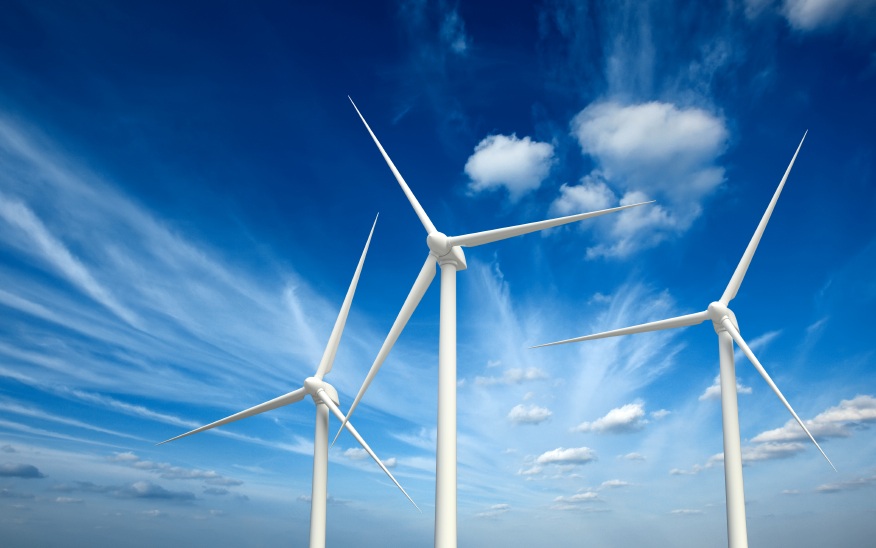 Green renewable energy concept - wind generator turbines in sky
